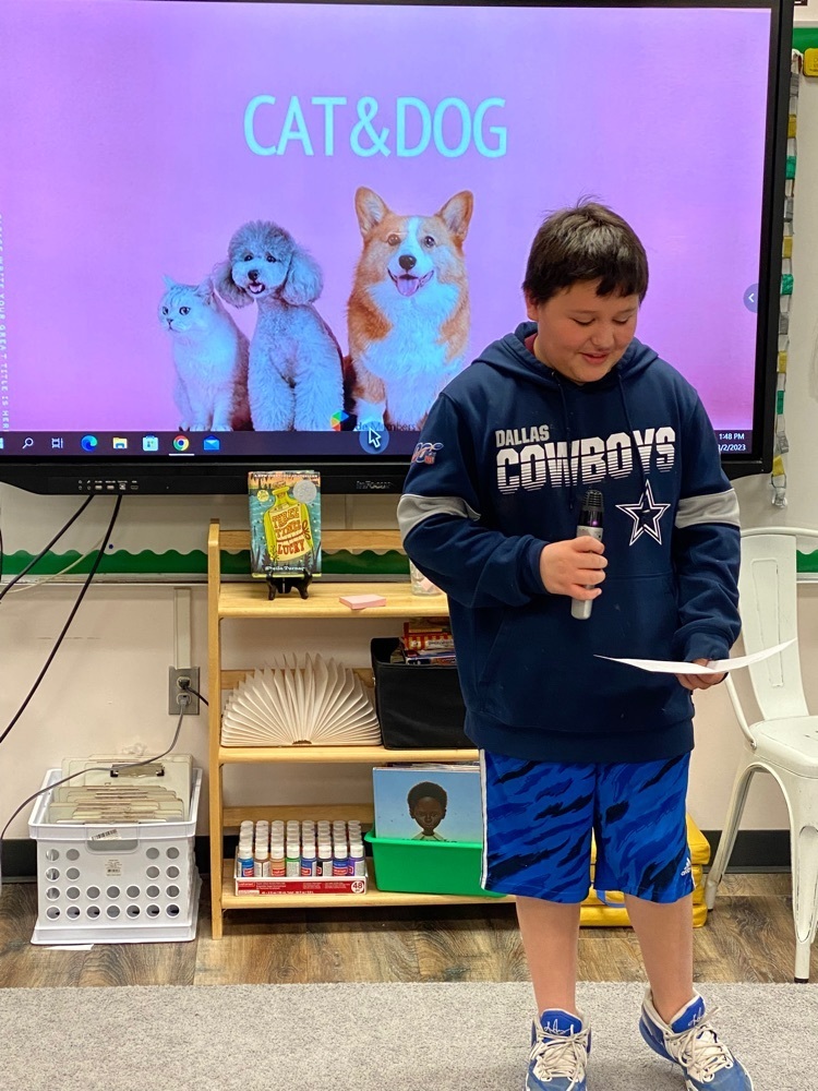 5th grade students present their opinion writing on which pet is best: a cat or a dog